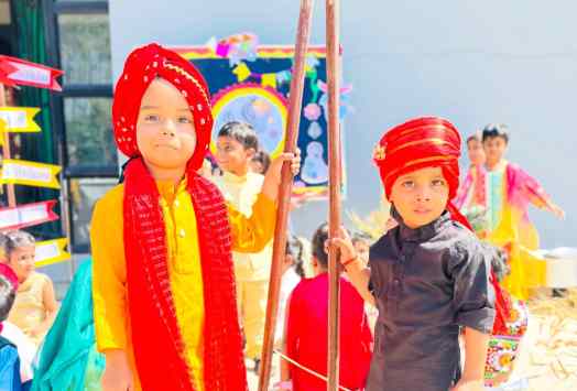 Children dressed in colourful traditional costumes for a school activity