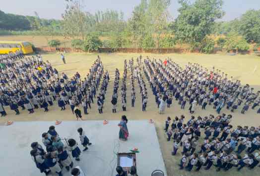 Students of AIPS in a disciplined assembly formation on the school ground
