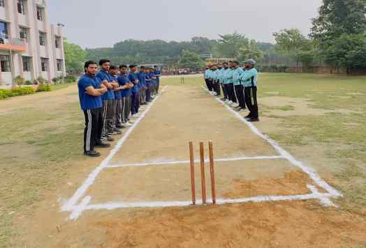 Students lined up on the playground in cricket kit