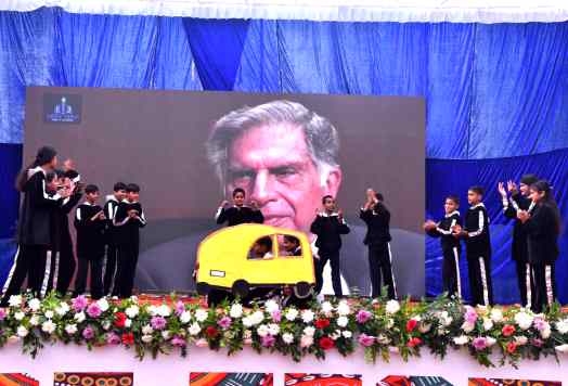 Students performing together on stage during a school function